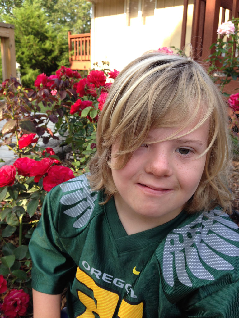 Erik my beautiful boy with Downs Syndrome and 'Europeana' in the garden